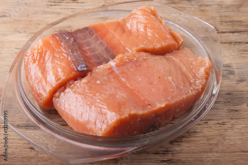 Salted salmon fillet on a glass platter
