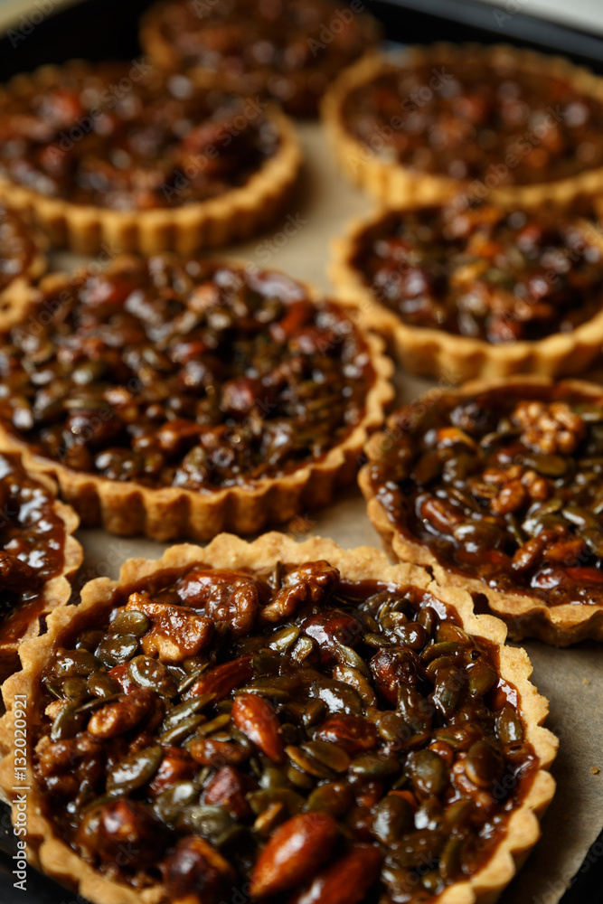 Not baked delicious cakes with nuts on pan. Not baked delicious cakes with nuts on pan.