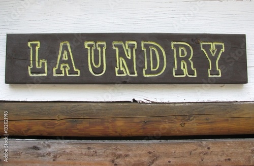 Laundry wooden sign attached to a wall