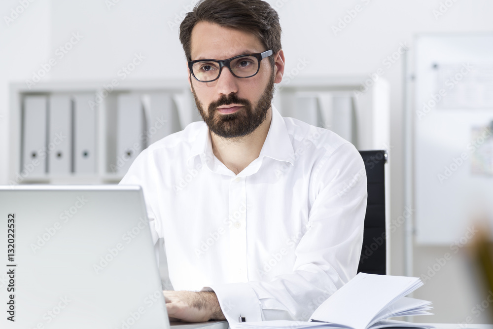 Fototapeta premium Bearded businessman making business plan