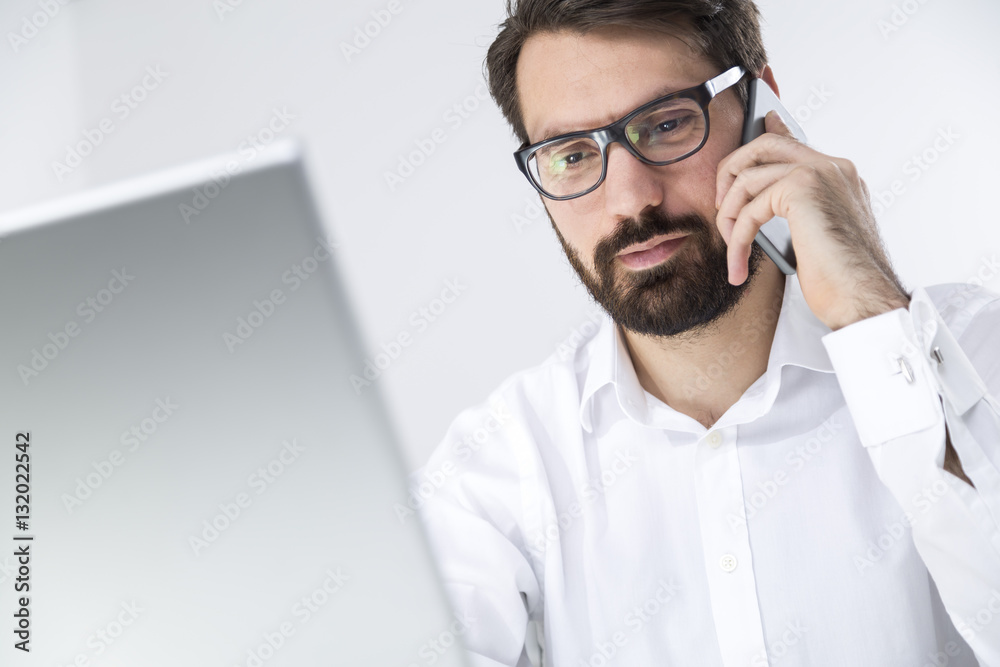 Young manager talking to the client on the phone Young manager talking to the client on the phone