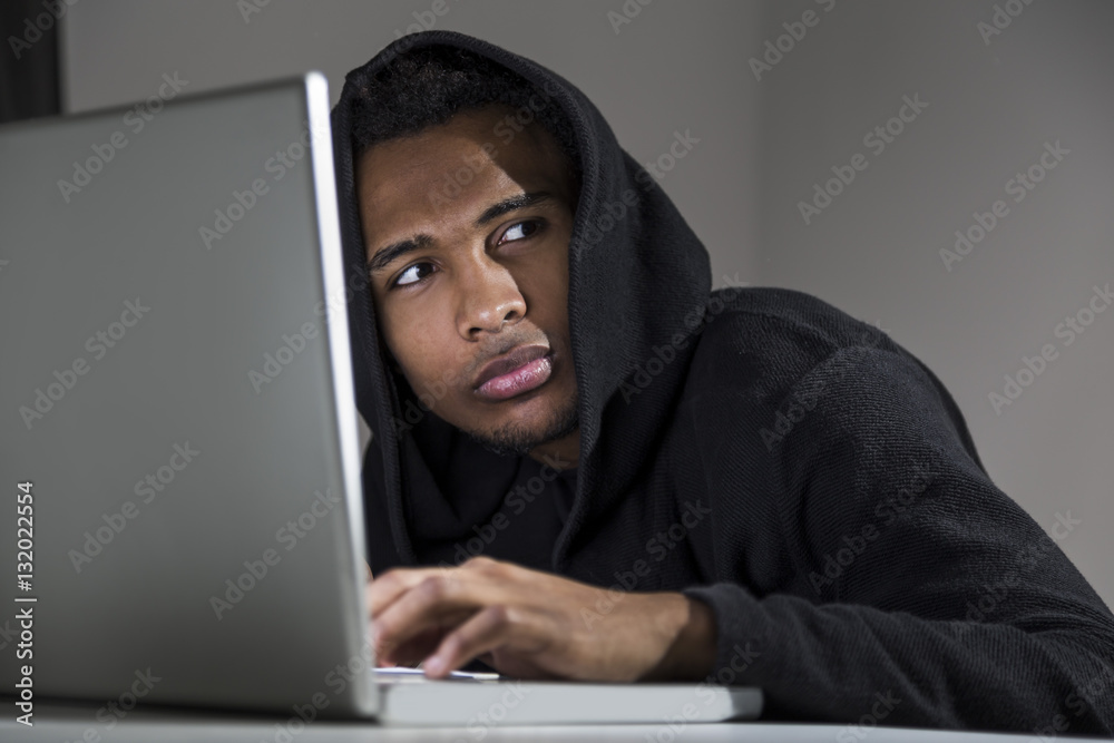 Close up of frightened African American hacker Close up of frightened African American hacker