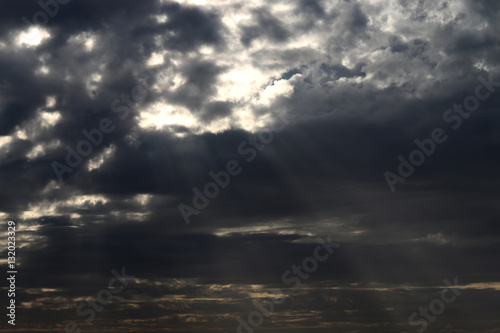 Very nice unusual sunset in winter, cloudy sky, with clouds sun ray