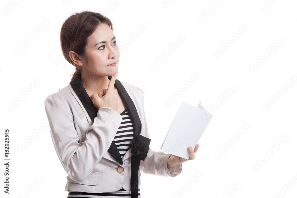 Young Asian business woman with a book is thinking. Young Asian business woman with a book is thinking.