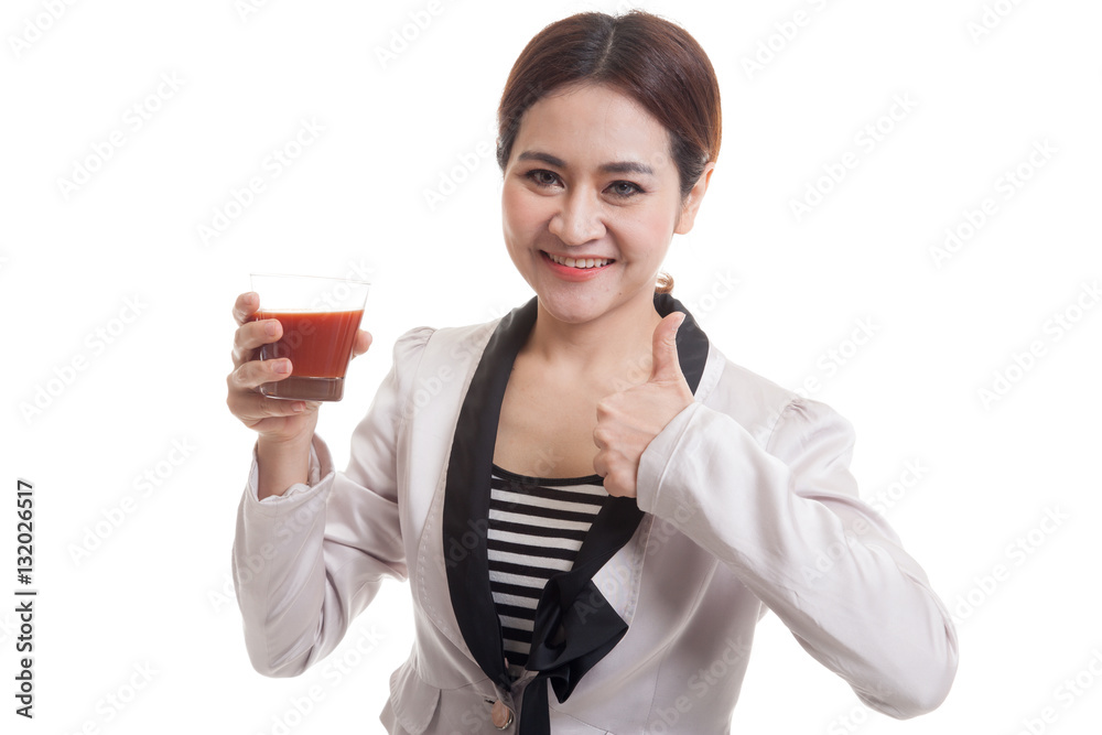 Young Asian business woman thumbs up with tomato juice. Young Asian business woman thumbs up with tomato juice.