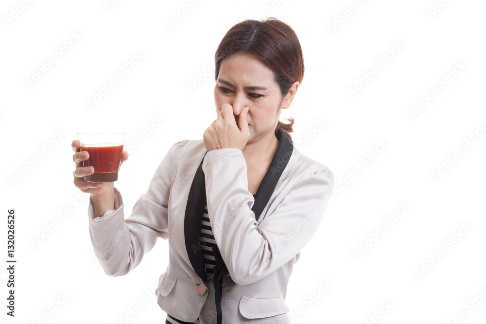 Young Asian business woman hate tomato juice. Young Asian business woman hate tomato juice.