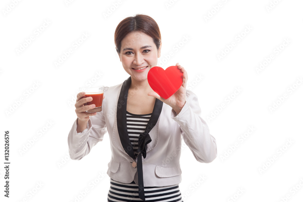 Young Asian business woman with tomato juice and red heart. Young Asian business woman with tomato juice and red heart.