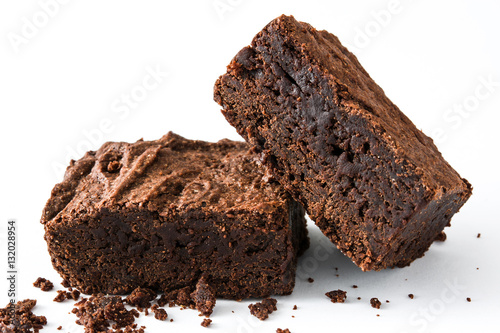 Chocolate brownie pieces isolated on white background
