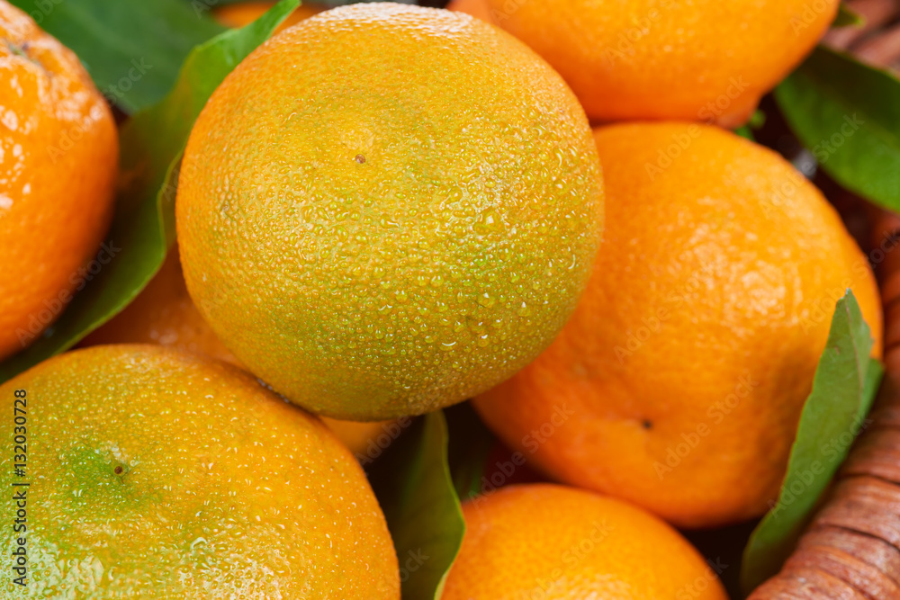 Fresh tangerines with leaves. Fruit background Fresh tangerines with leaves. Fruit background