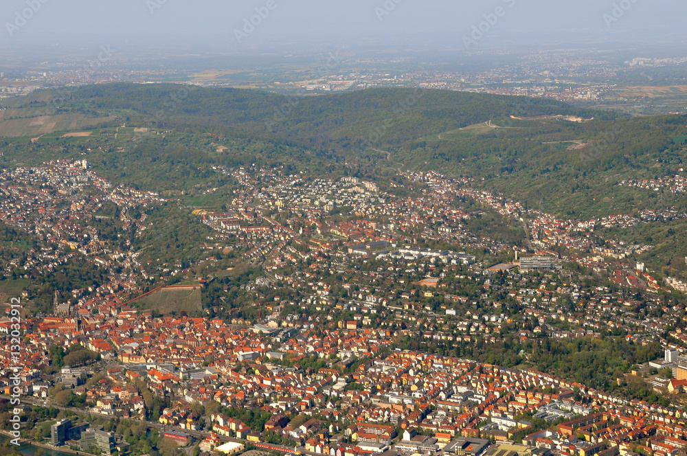 Aerial view of the old town Esslingen, Baden-Wurttemberg, Germany. A lot of red roofs of old buildings on the hilly terrain.