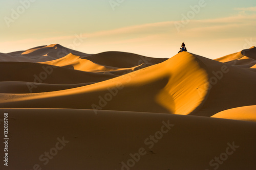 People waiting for Sunrise at the dunes at Hassi Labiad, Morocco