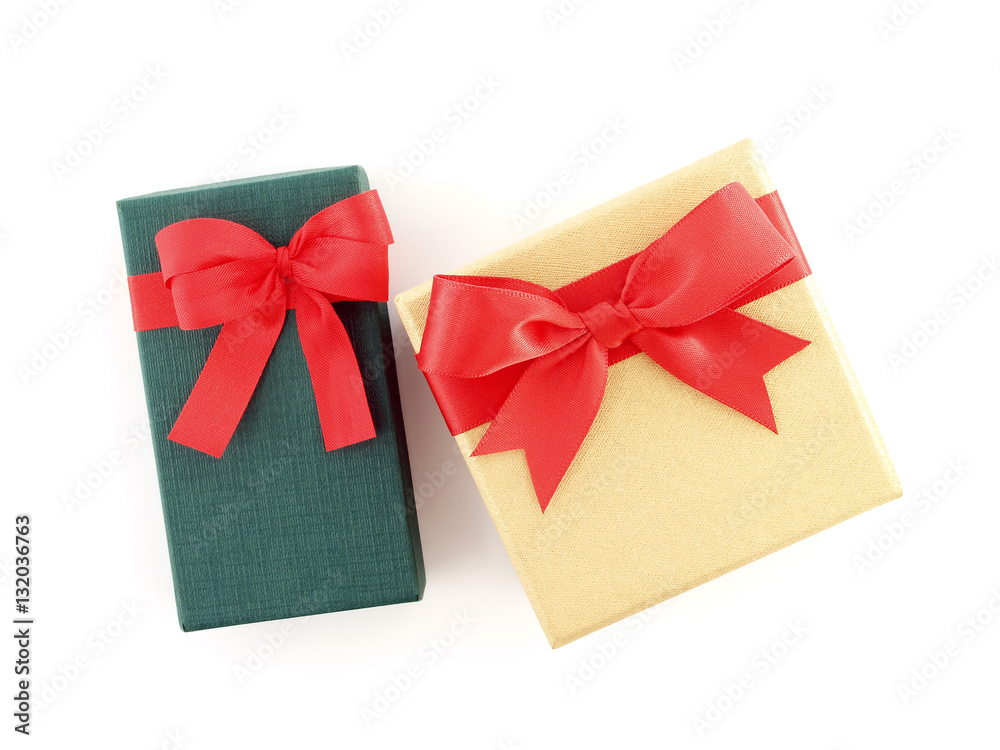 two gift boxes with red ribbon bow isolated on white background, rectangle and square cardboard boxes wrapped in green and yellow gold with simple tied bow for put presents, flat lay close up top view two gift boxes with red ribbon bow isolated on white background, rectangle and square cardboard boxes wrapped in green and yellow gold with simple tied bow for put presents, flat lay close up top view