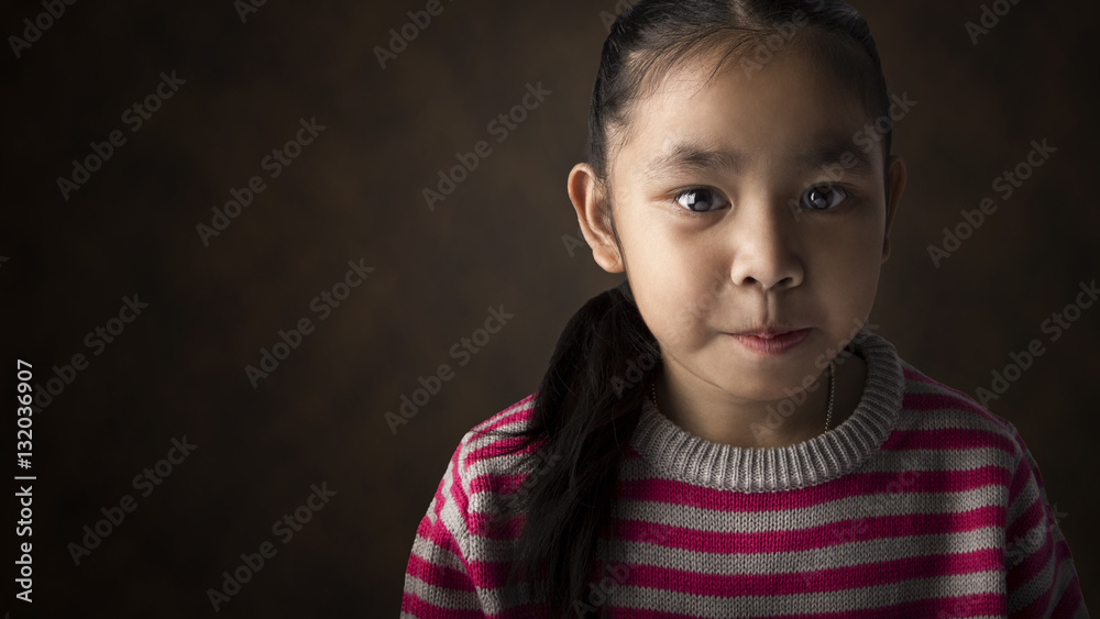 Portrait of Asian little girl with cute sweater.Studio shooting Portrait of Asian little girl with cute sweater.Studio shooting