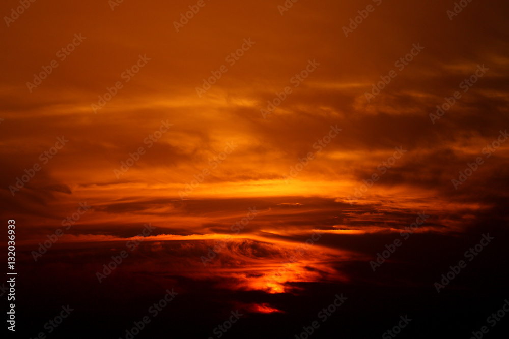 Magical very beautiful sunset in cloudy sky, sun ray in the sea of clouds