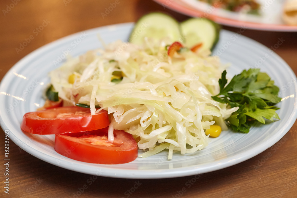 Fresh salad, mixed vegetables on a plate Fresh salad, mixed vegetables on a plate