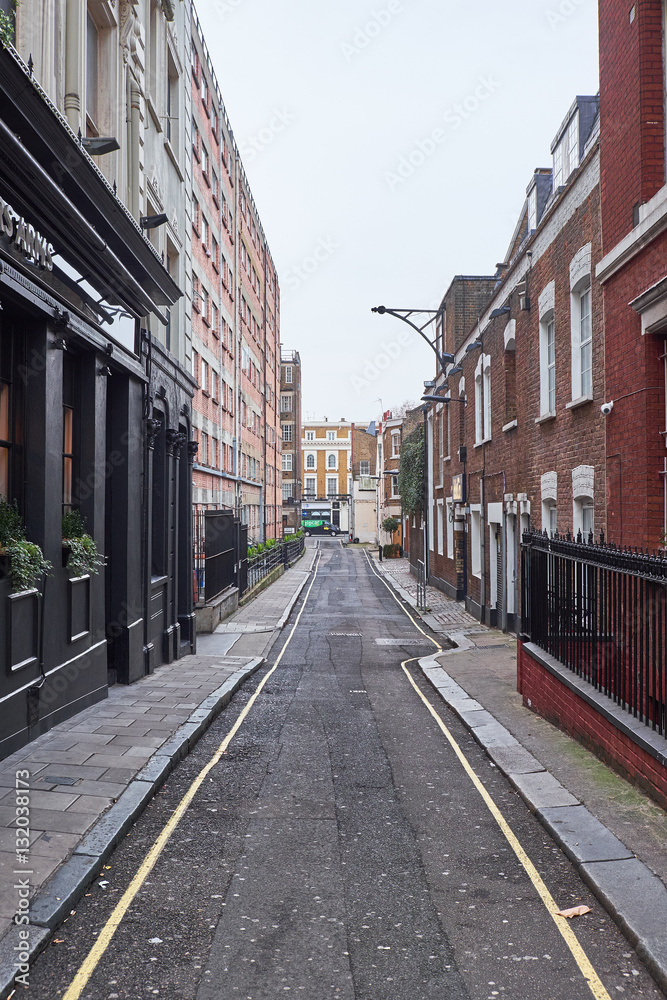 A look down Conduit Place, a narrow alley with highrise and low residential buildings A look down Conduit Place, a narrow alley with highrise and low residential buildings