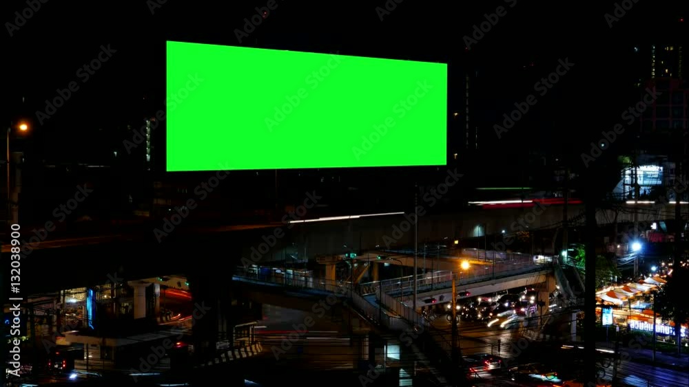 Advertising Billboard with green screen and traffic at night, for advertisement, time lapse. Advertising Billboard with green screen and traffic at night, for advertisement, time lapse.
