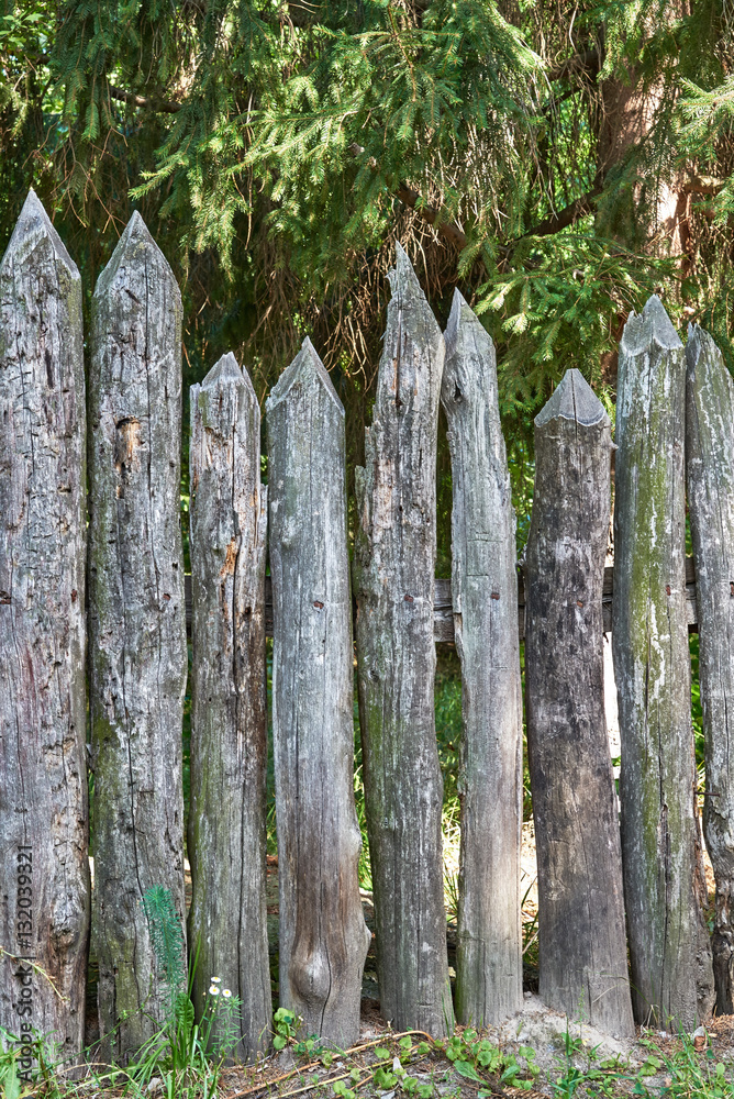 The old wooden fence in the countryside