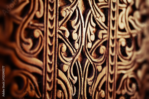 Orintal texture on a wood. Door in one of Uzbekistans' mosque photo