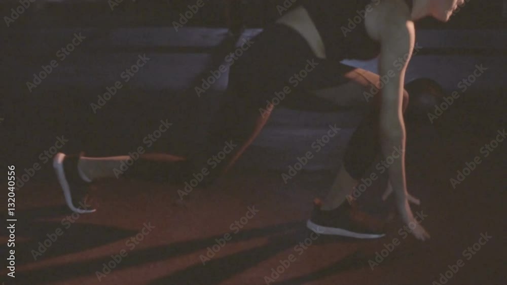 Brunette pretty slim woman doing speed lunge workout at the gym - video in slow motion. Fitness, sport, training and people concept