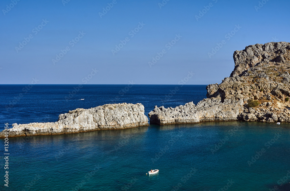 Rock and the bay in the Mediterranean Sea on the island of Rhodes.