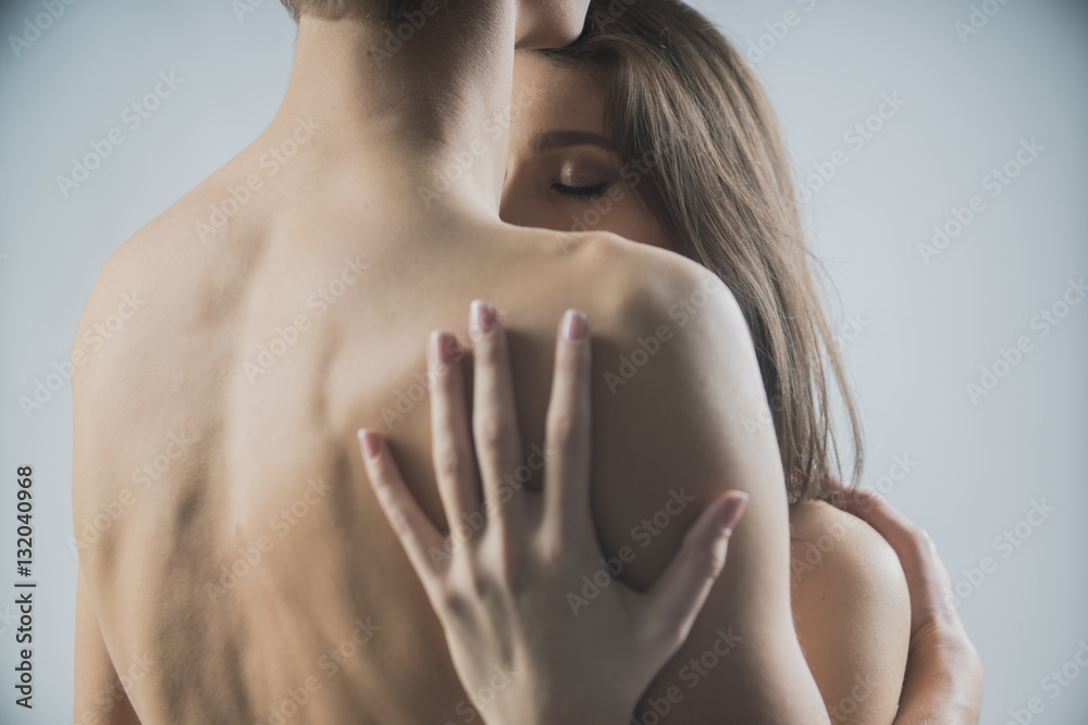 Close-up portrait of a passionate young people in love. Emotive of a sexy couple
