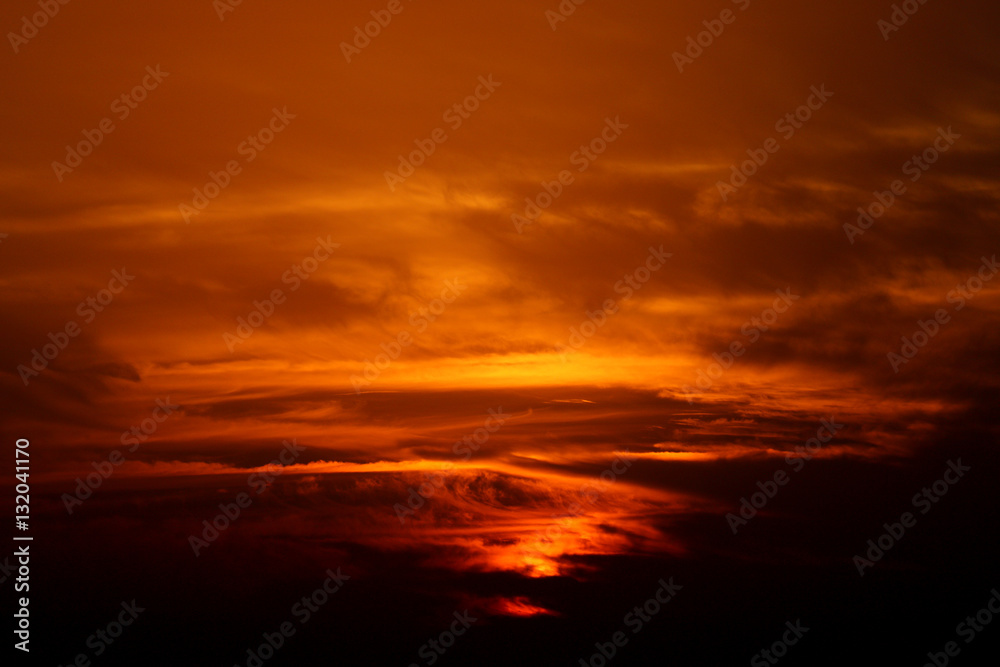 sunset in winter, cloudy sky, sun ray in the sea of clouds