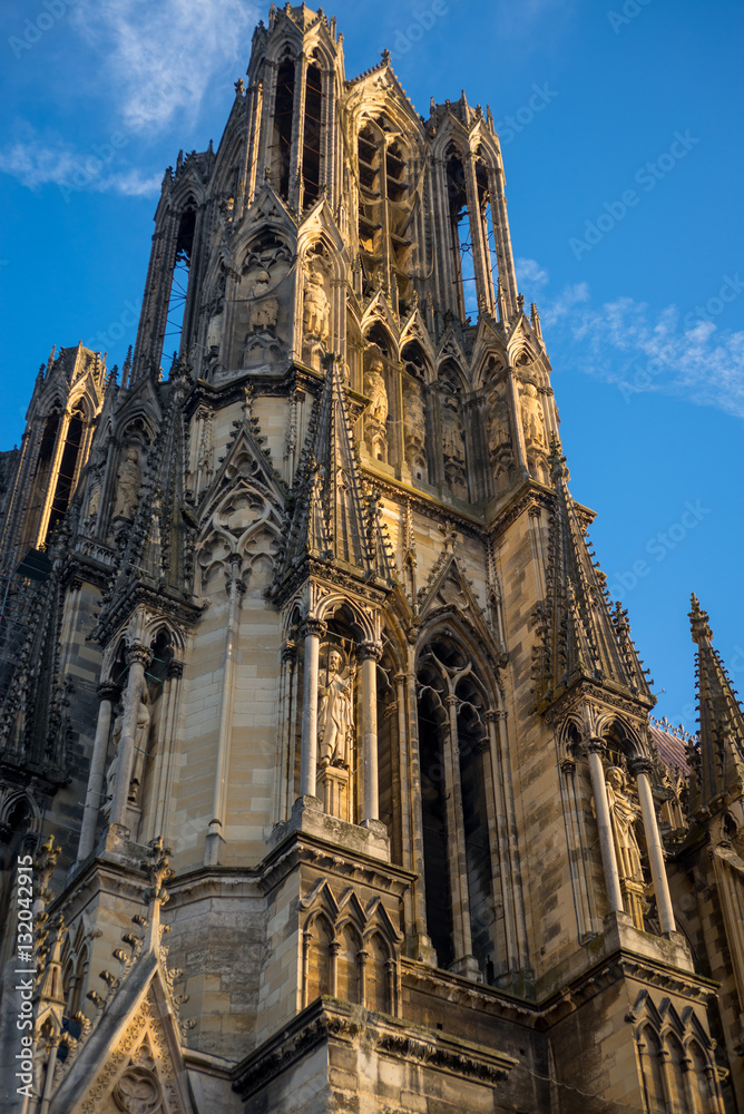 Bell tower of Reims cathedral at day light, France