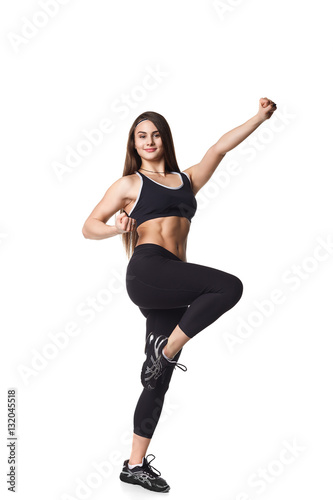 Athletic fitness woman helthy sport isolated white background young female health muscles copy space black clothes smilling attractive beautyful stretch activity copy space empty