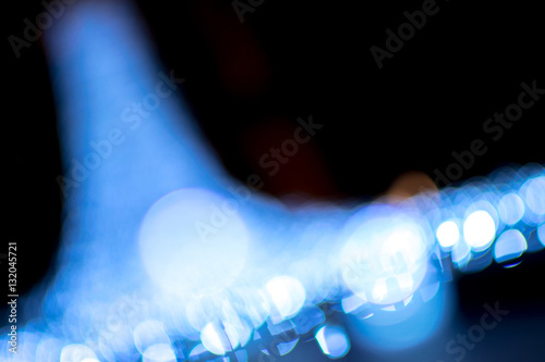 Abstract bokeh and lens flare pattern in the dark with vintage filter background