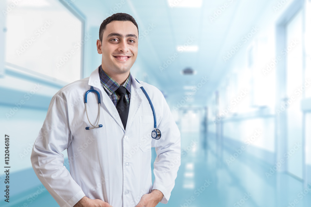 Portrait of friendly male doctor smiling Portrait of friendly male doctor smiling