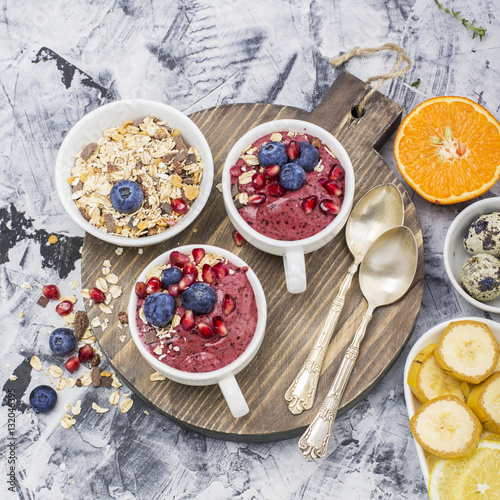 Wallpaper Mural Healthy breakfast. Blueberry banana smoothie in a la carte dishes with granola and pomegranate on  marble background. selective focus Torontodigital.ca