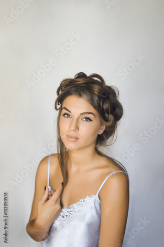 beautiful girl with an unusual hairdo smiling  