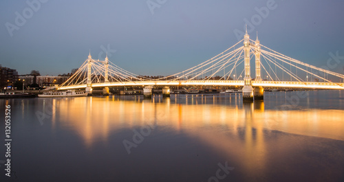Illuminated Albert bridge in west London at night © panifuzja
