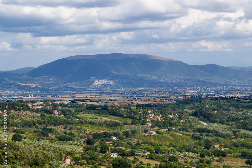 Perugia, Italy. A scenic view of the surrounding area. In the center of the frame, on the hillside - Assisi