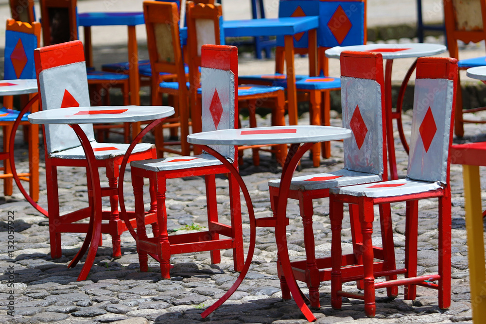 colourful cow hide chairs outdoors on coffee-shop patio in El Jardin Colombia