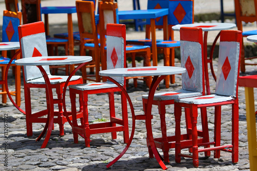 colourful cow hide chairs outdoors on coffee-shop patio in El Jardin Colombia © Barna Tanko