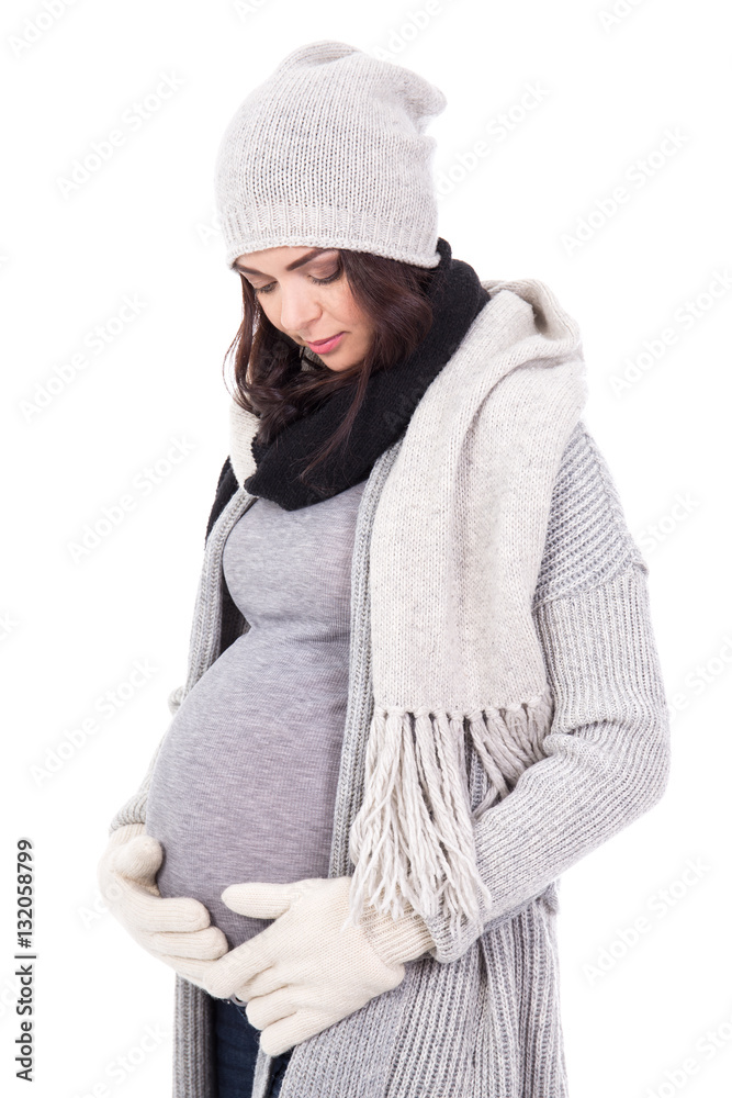 young pregnant woman in winter clothes isolated on white young pregnant woman in winter clothes isolated on white