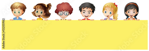 Many children holding yellow sign