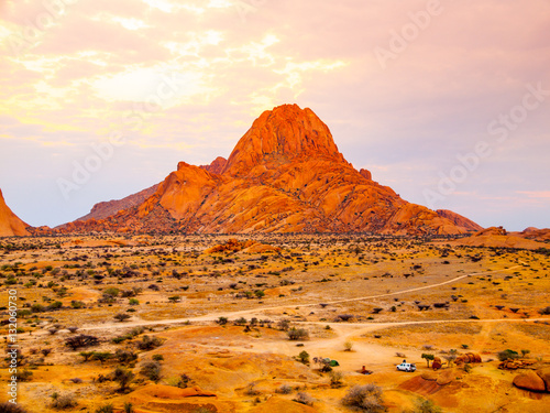 Spitzkoppe, aka Sptizkop - unique rock formation of pink granite in Damaraland landscape, Namibia, Africa. photo