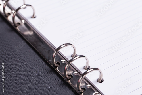 Wallpaper Mural Loop black leather book on white background. Torontodigital.ca