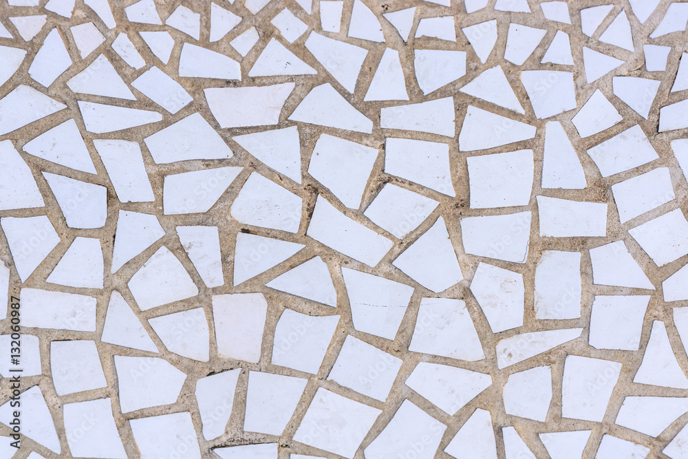 Pattern of broken white tiles, brittle, mosaic, trencadis breakable, front view, enamelled ceramics glazed Pattern of broken white tiles, brittle, mosaic, trencadis breakable, front view, enamelled ceramics glazed