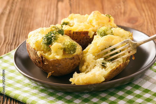 Twice baked potatoes stuffed with broccoli, sour cream and cheese.