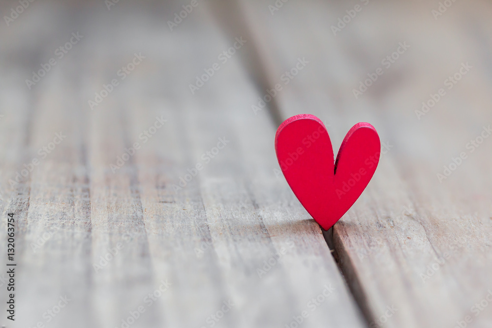 One red heart stands on wood table , Winner of love concept One red heart stands on wood table , Winner of love concept