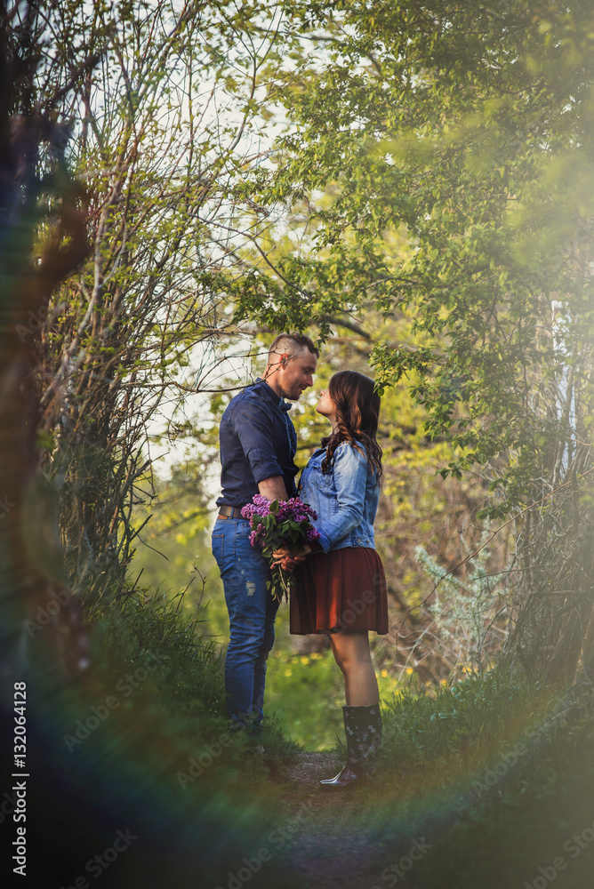 loving young couple holding hands and kissing loving young couple holding hands and kissing