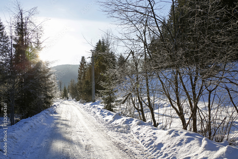 winter mountain landscape with road with colorful lens flares winter mountain landscape with road with colorful lens flares