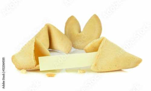 A broken Chinese fortune cookie with a blank message space on a white background