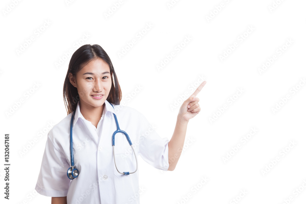 Asian young female doctor point to blank space. Asian young female doctor point to blank space.