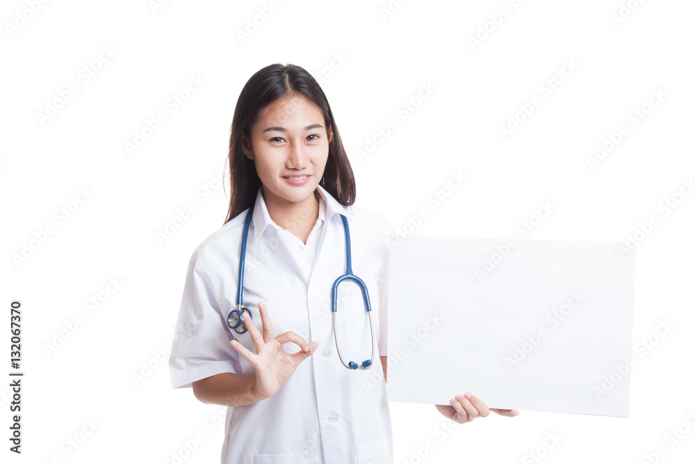 Asian female doctor show OK sign with blank sign. Asian female doctor show OK sign with blank sign.