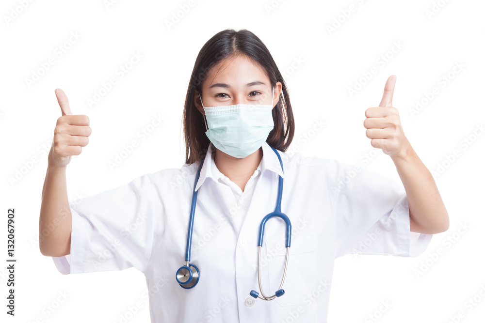 Young Asian female doctor thumbs up with both hands. Young Asian female doctor thumbs up with both hands.